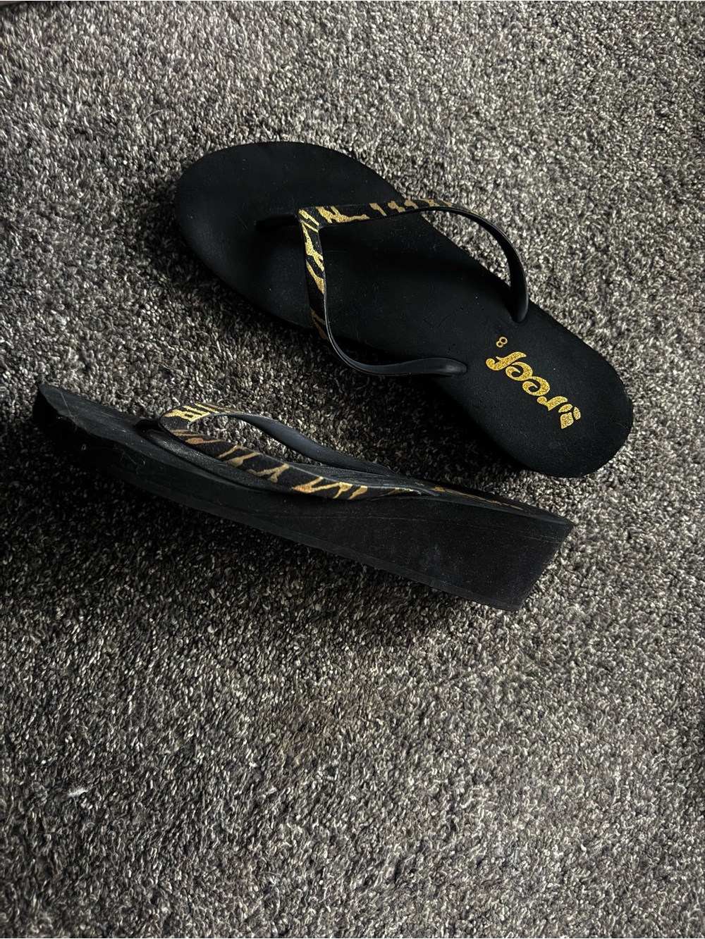 Reef Women’s Black Wedge Sandals with Gold Zebra Strap